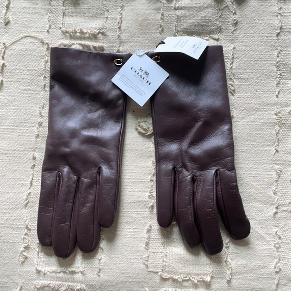 Brown Coach leather gloves with tags